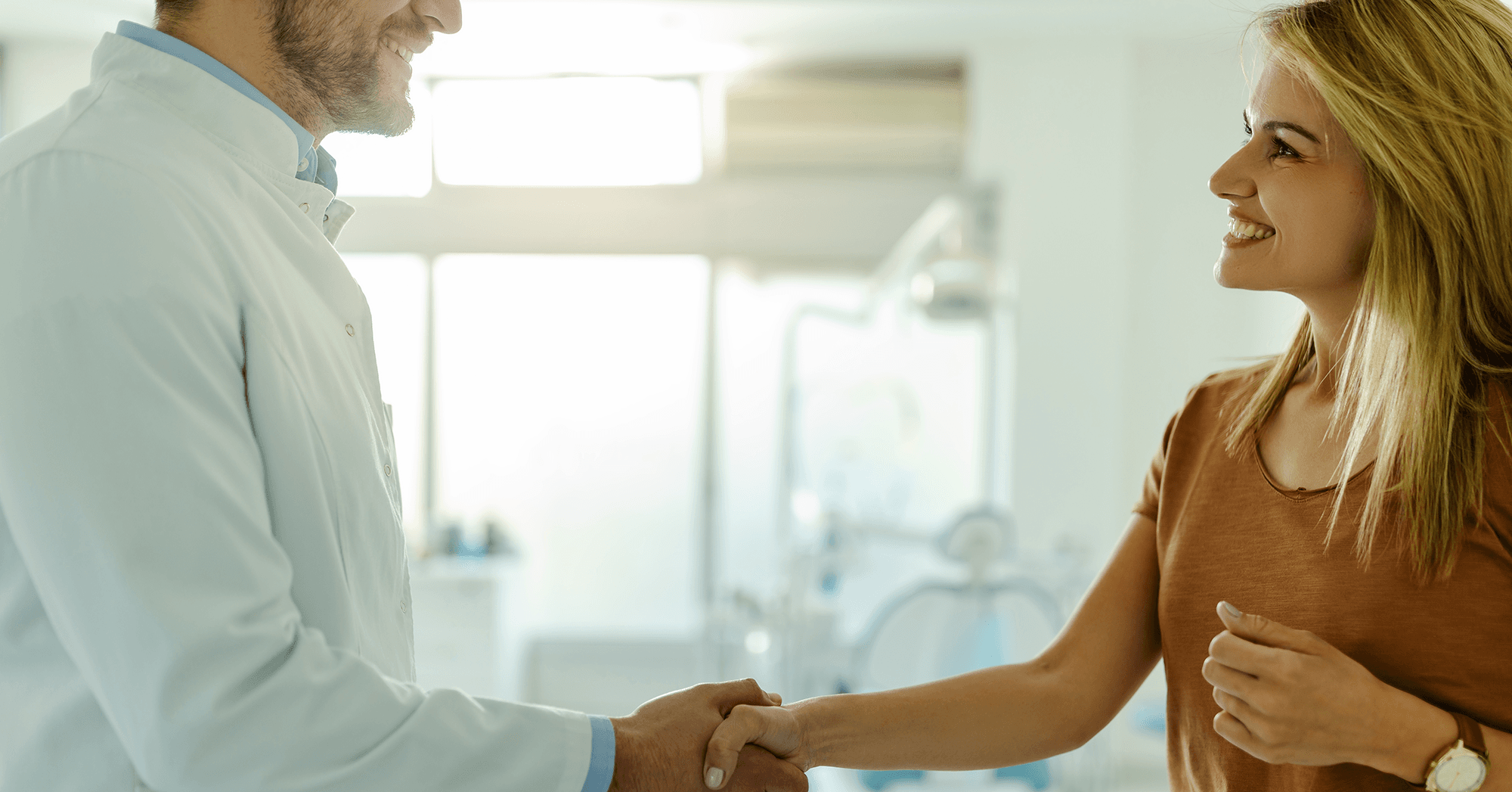 A man and a woman shaking hands